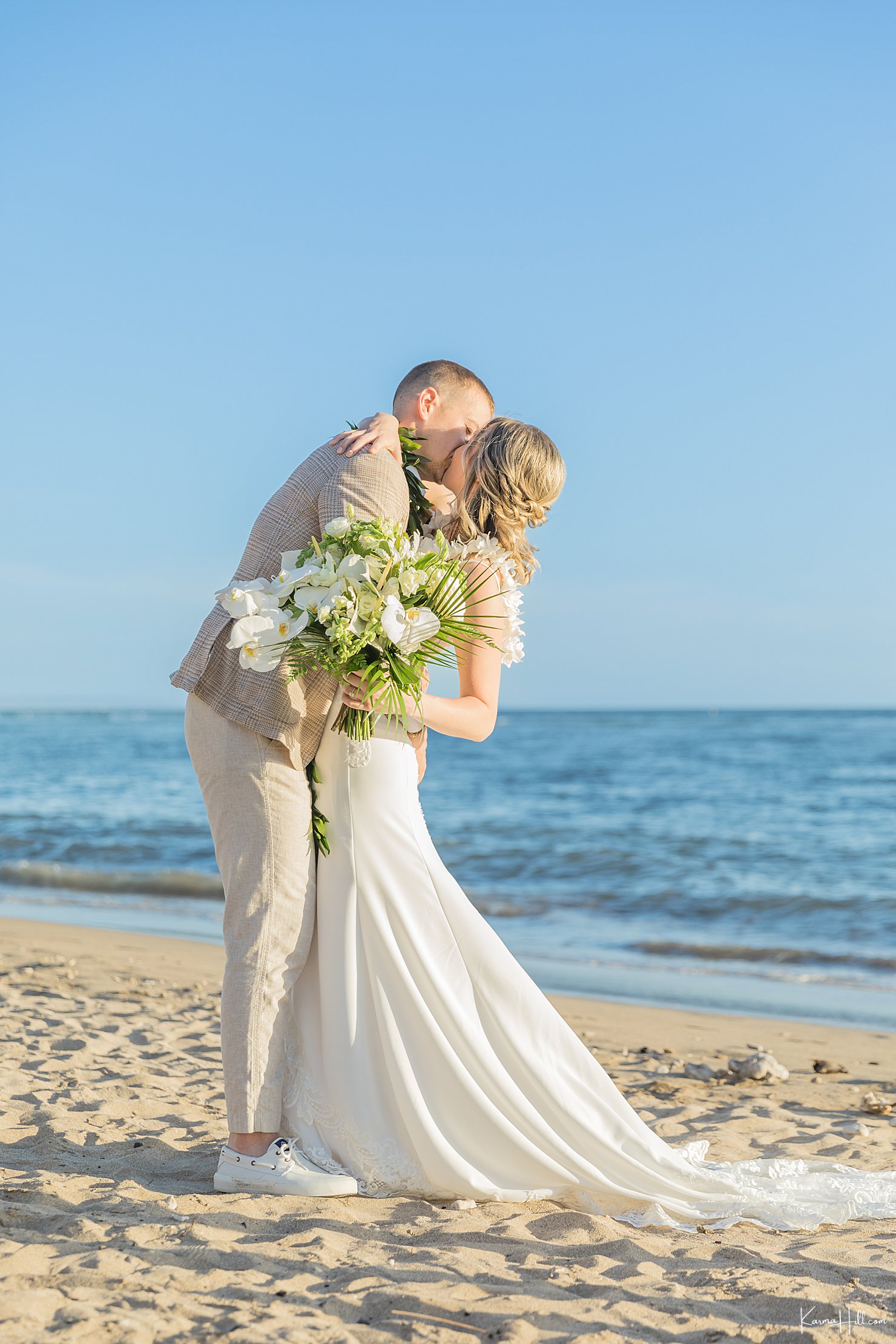 Maui beach wedding - first kiss